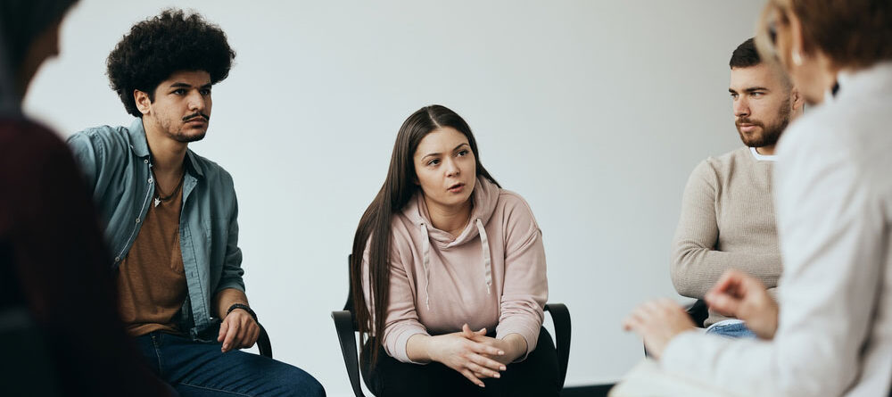 circle of group therapy practicing mindfulness-based cognitive therapy