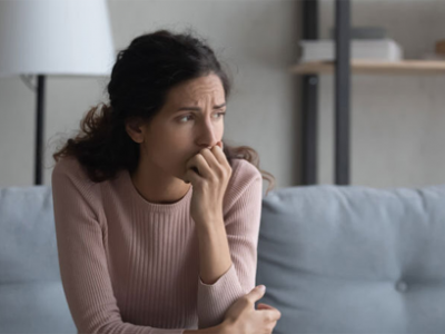 worried woman on the couch